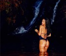 Rihanna showing off her Figure in a wildly sexy suimsuit ensemble. See the Photos of RiRi in the same swimsuit smoking a joint!