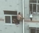 Man Saves Little Girl Hanging From Window