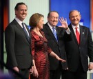 Republican presidential candidates (L-R) Rick Santorum, Carly Fiorina, Mike Huckabee and Jim Gilmore pose for photographers prior to the Fox News - Google GOP Debate January 28, 2016 at the Iowa Events Center in Des Moines, Iowa. Residents of Iowa will vo