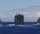 USNS Cesar Chavez replenishes Royal Australian Navy ships.