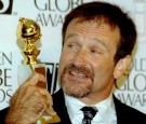 Robin Williams holds his Golden Globe after winning for best actor in a comedy for his role in 'Mrs. Doubtfire' 