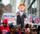 Activists Protest For Immigration Reform And Fair Wages At Trump Tower In Chicago
