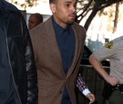 Recording artist Chris Brown enters the Los Angeles Courthouse on February 3, 2014 in Los Angeles, California. 